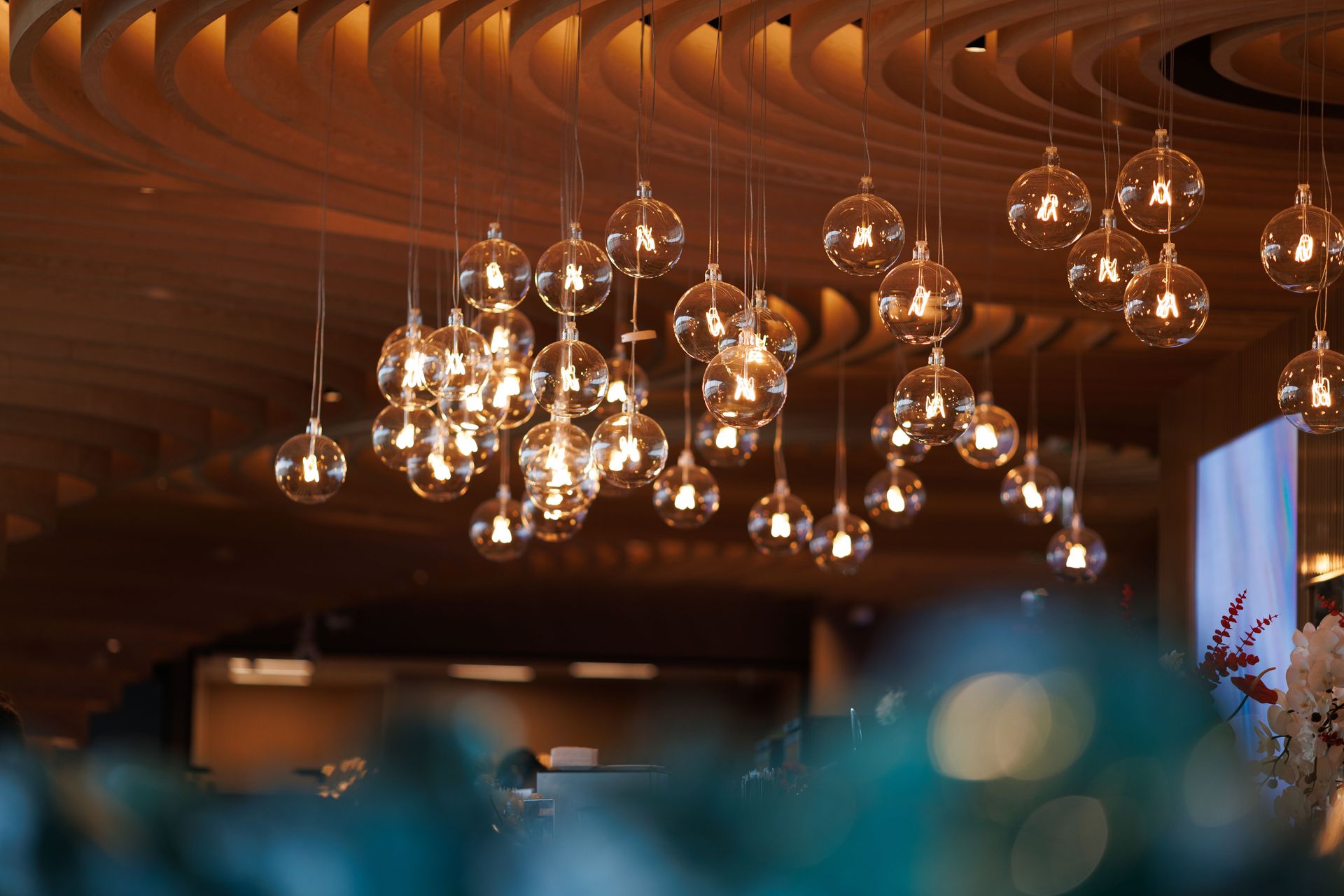 Modern interior lighting with hanging glass bulbs, creating a warm and elegant ambiance.